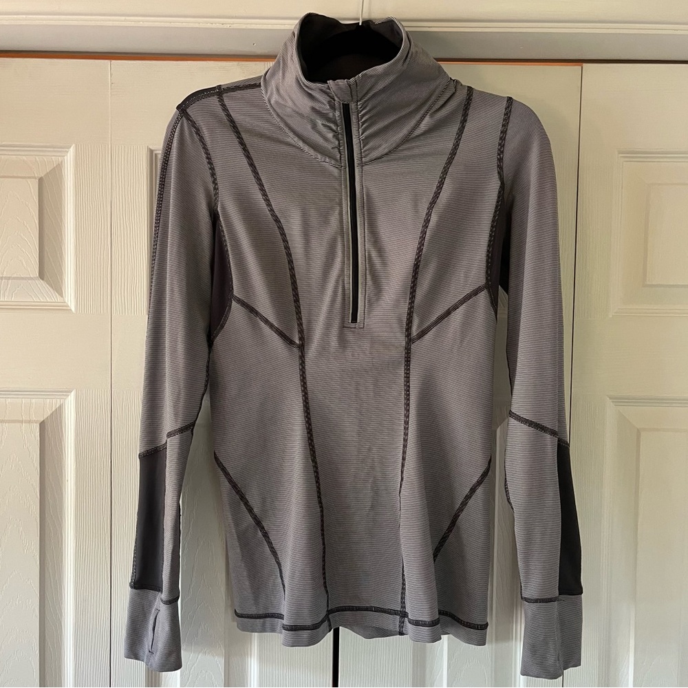 Lululemon Size 8 Pull Over. Grey & white stripe w/ back pocket and thumb holes.